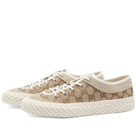 gucci tortuga gg sneaker|Men's GG sneaker in beige and ebony GG canvas .